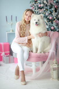 Low section of woman with dog