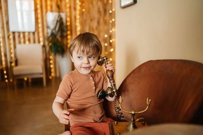 Little boy with antique phone. high quality photo