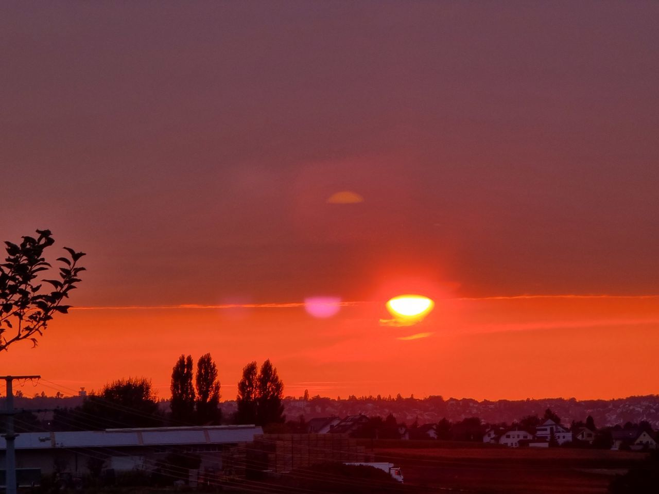 SCENIC VIEW OF SILHOUETTE LANDSCAPE AGAINST ORANGE SKY