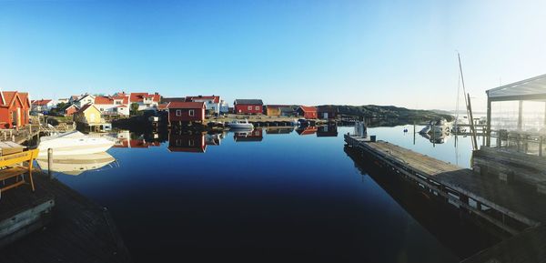 Buildings in city against clear sky