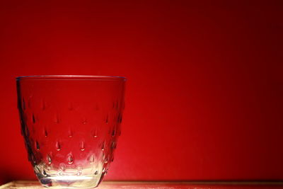 Close-up of drink against red background