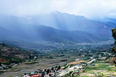 High angle view of boats in mountains against sky