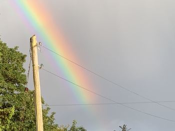 Low angle view of rainbow against sky