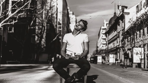 Woman with umbrella in city