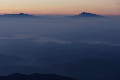 Scenic view of mountains against sky during sunset