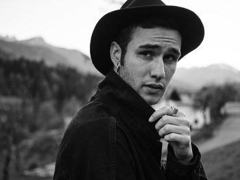 Close-up of young man wearing hat