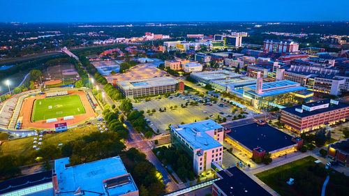 High angle view of illuminated buildings in city