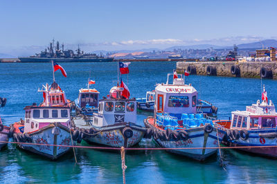 Boats moored at harbor