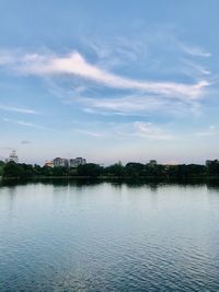 Scenic view of lake by building against sky