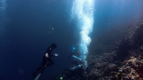 People swimming in sea