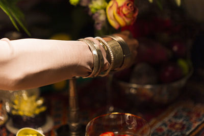 Close-up of hand pouring water in glass