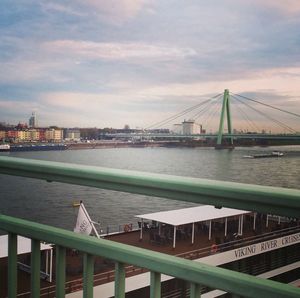 Bridge over river with city in background
