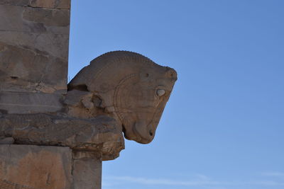 Low angle view of statue against sky