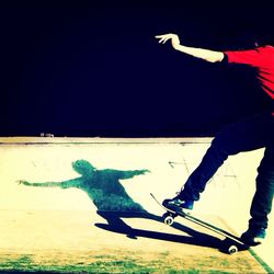 Low angle view of woman skateboarding