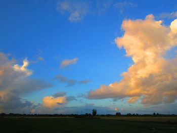 Scenic view of field against sky during sunset