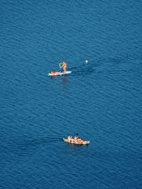 High angle view of kayaking in sea