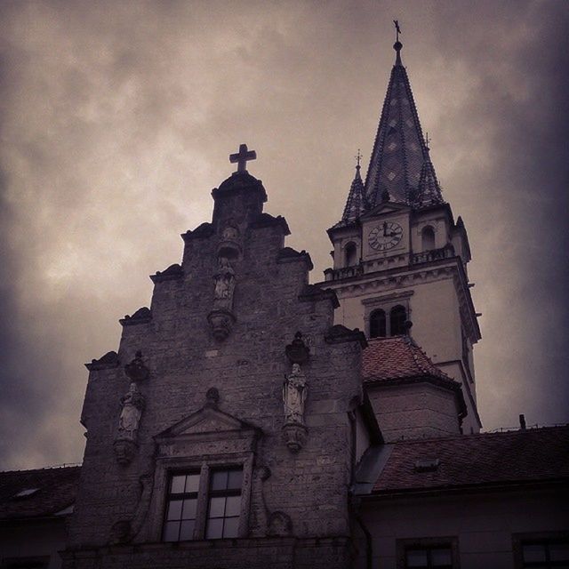 architecture, building exterior, religion, built structure, place of worship, low angle view, spirituality, church, sky, cathedral, cross, history, cloud - sky, old, clock tower, cloud, outdoors, day