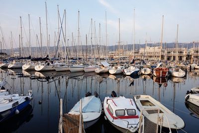 Boats moored at harbor