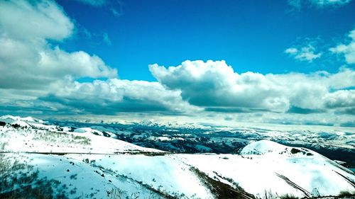 Scenic view of landscape against cloudy sky