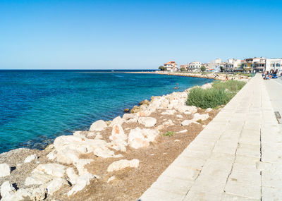 Scenic view of sea against clear blue sky