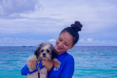 Side view of dog against sky