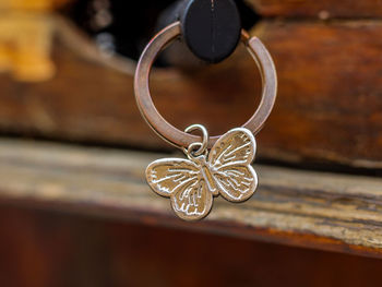 Close-up of ring with metallic butterfly