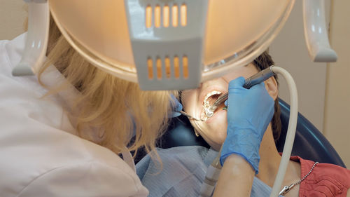 Dentist examining patient