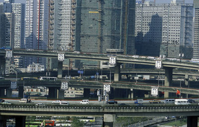 Elevated roads against buildings in city