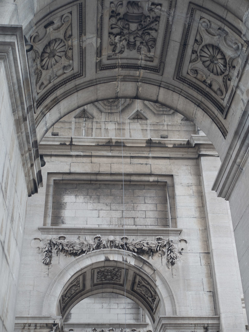 LOW ANGLE VIEW OF ORNATE BUILDING