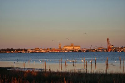 Scenic view of sea against clear sky during sunset