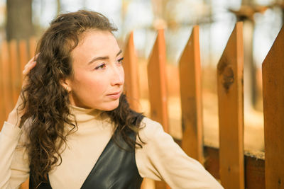 Smiling young woman looking away