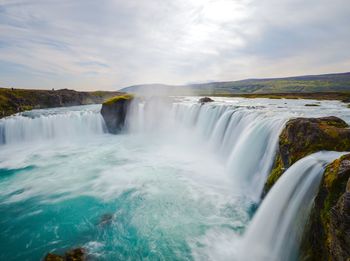 View of waterfall against sky