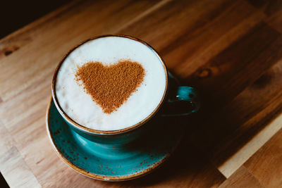 High angle view of coffee cup on table