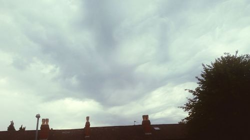 High section of building against cloudy sky