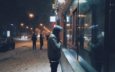 People on street in city at night