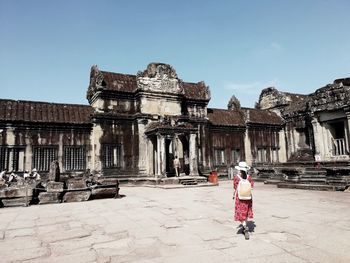 People in front of historical building