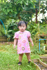 Portrait of boy standing in park