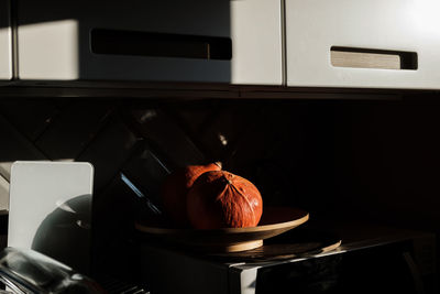 Close-up of orange on table at home