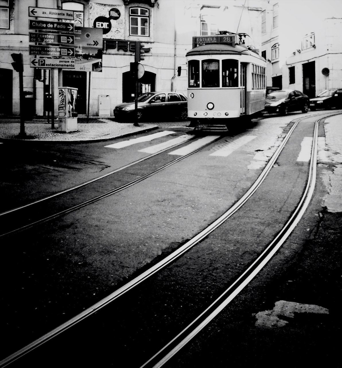 transportation, railroad track, public transportation, mode of transport, rail transportation, railroad station platform, train - vehicle, building exterior, railroad station, built structure, architecture, land vehicle, city, travel, train, passenger train, public transport, car, high angle view, on the move