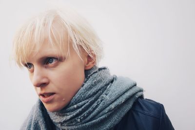 Portrait of cute boy against white background