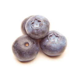Close-up of fruits over white background