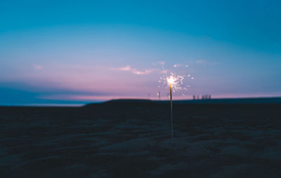 Scenic view of beach against sky during sunset