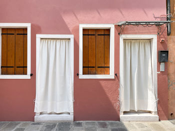 Windows in the colorful house in burano