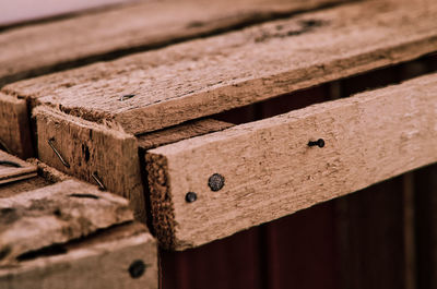 Close-up of old rusty stack on wood