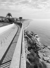 Scenic view of swimming pool by sea against sky