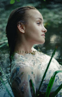 Portrait of young woman looking away