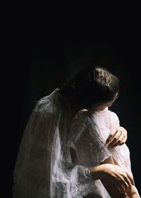 Woman with old white embroidered cloak 