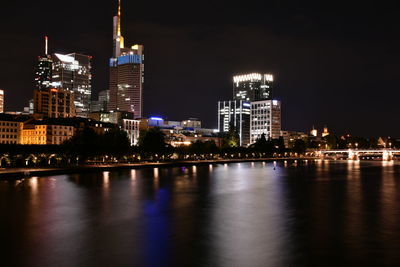 Illuminated buildings at waterfront