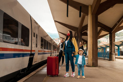 Rear view of women walking on train