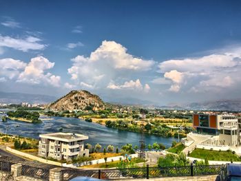 View of town against cloudy sky